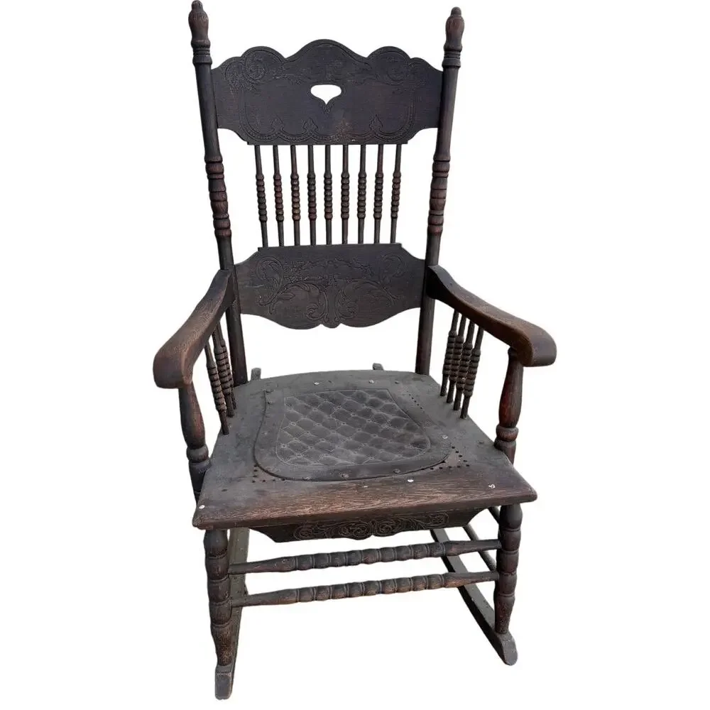 Antique Spindle Rocking Chair With Carvings and Cutout accent
